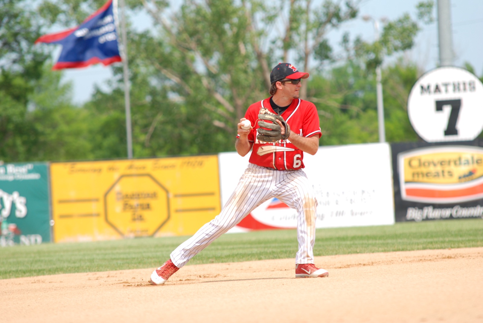 Zach playing shortstop in his pro days, mid-throw on the infield